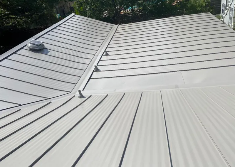 Solar attic fan installed on a metal roof for Roof Ventilation in Philadelphia