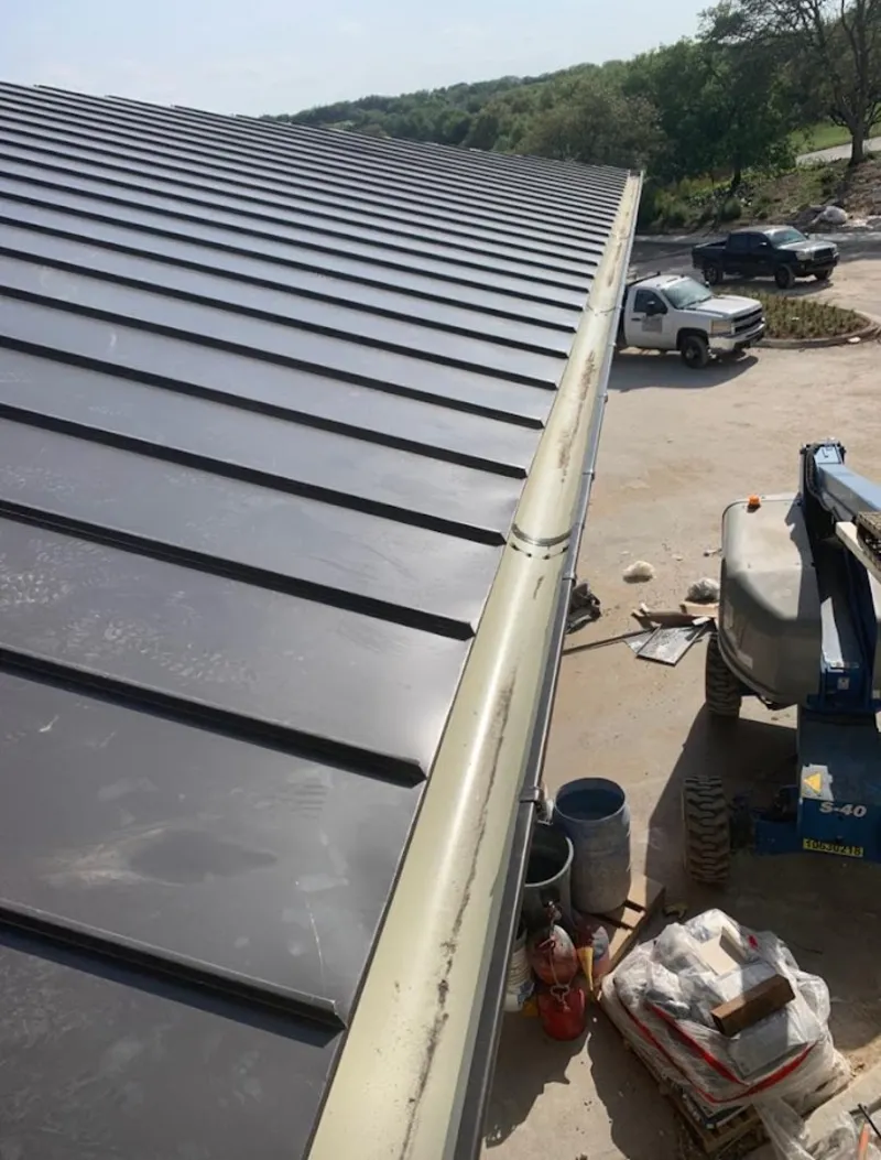 Standing seam panel and gutter detail on a metal roofing jobsite in Philadelphia